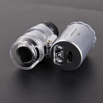 تصویر  میكروسكوپ جیبی چراغ دار  9882 LED-UV كامار (چین)  60X